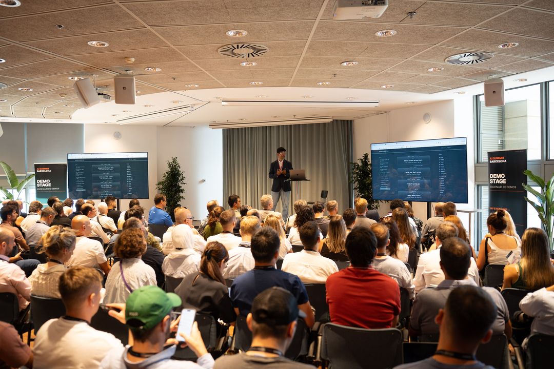 Sami on the Demo Stage at AI Summit Barcelona 2026, full room, workflow on both screens